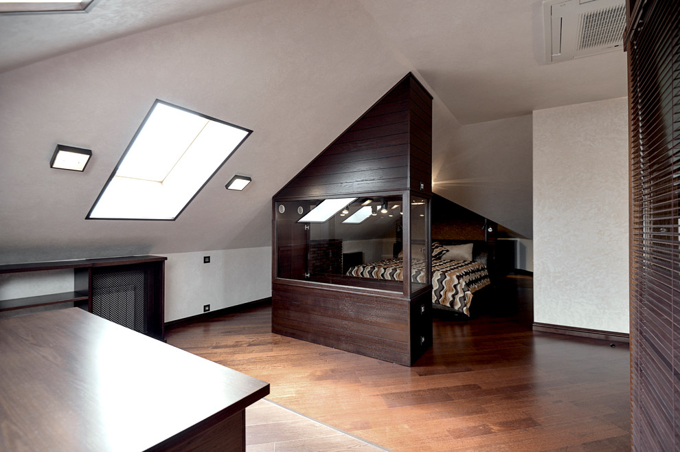 Large eclectic master bedroom in Other with beige walls, medium hardwood floors and brown floor.