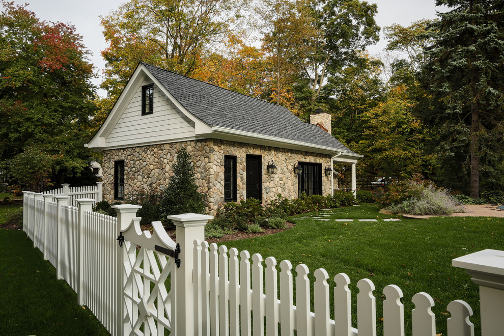Design ideas for a traditional exterior in New York with stone veneer.