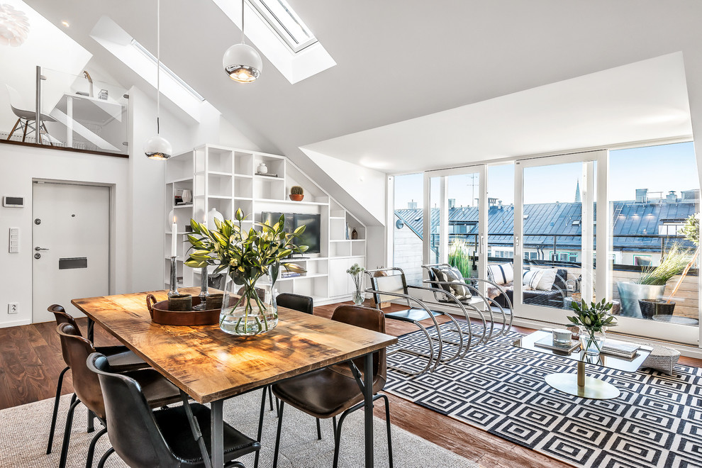 Design ideas for an expansive scandinavian open plan dining in Stockholm with white walls and dark hardwood floors.