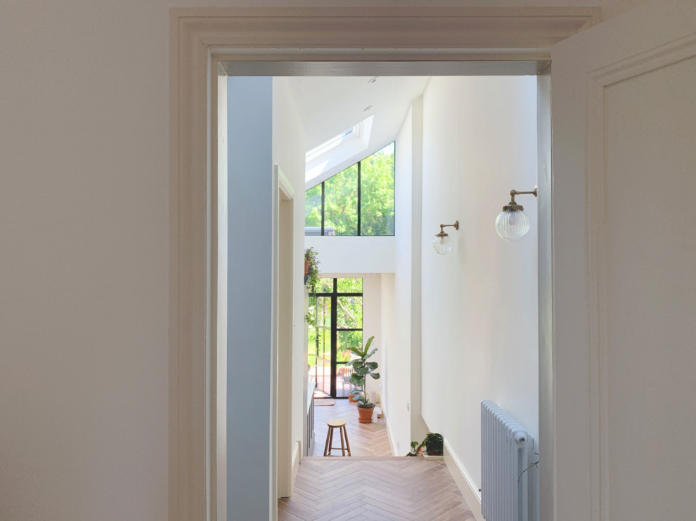 Inspiration for a contemporary hallway in West Midlands with medium hardwood floors.