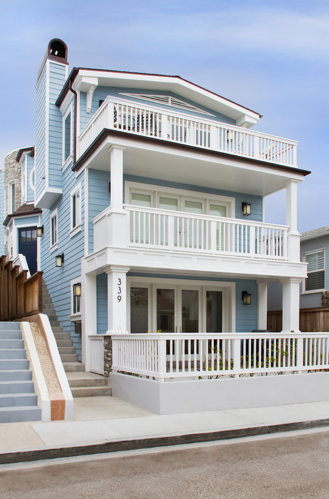 Design ideas for a large beach style three-storey blue exterior in Los Angeles with wood siding and a gable roof.