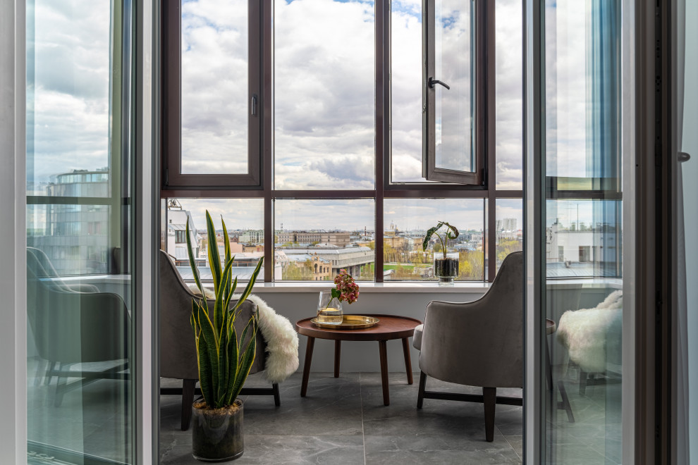 Photo of a mid-sized scandinavian sunroom in Saint Petersburg with ceramic floors and grey floor.