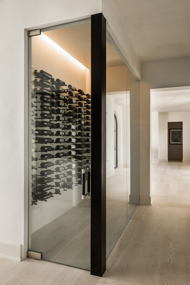 Design ideas for a modern wine cellar in Austin with storage racks.