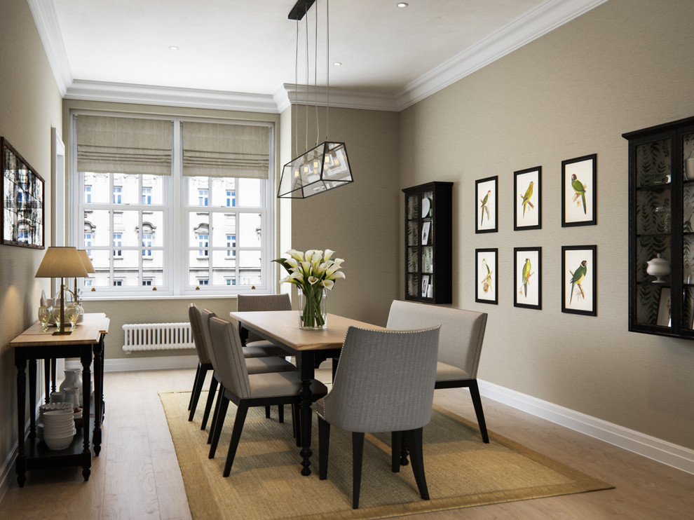 Mid-sized traditional dining room in London with beige walls and medium hardwood floors.