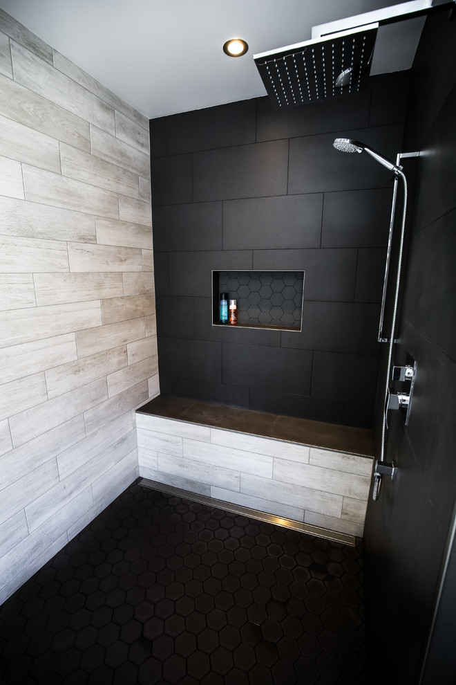 Inspiration for a large country master bathroom in Montreal with flat-panel cabinets, medium wood cabinets, a freestanding tub, a corner shower, black and white tile, porcelain tile, grey walls, porcelain floors, a vessel sink and laminate benchtops.