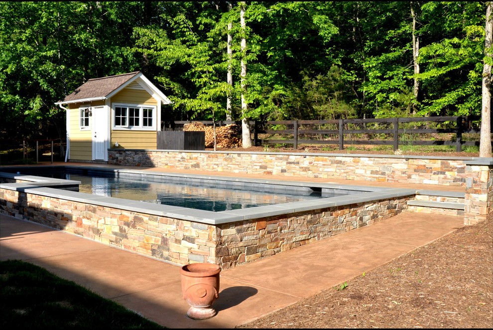 Inspiration for a mid-sized transitional backyard concrete paver and rectangular aboveground pool house remodel in Charlotte