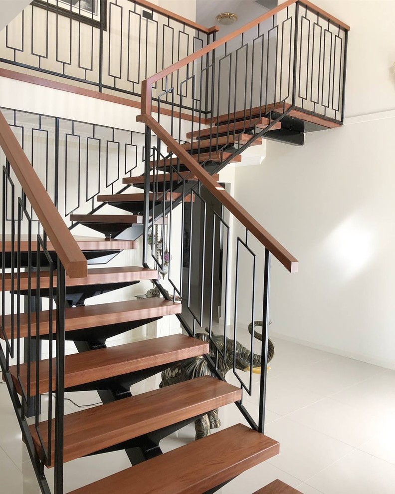 Design ideas for a contemporary wood l-shaped staircase in Sydney with metal railing.