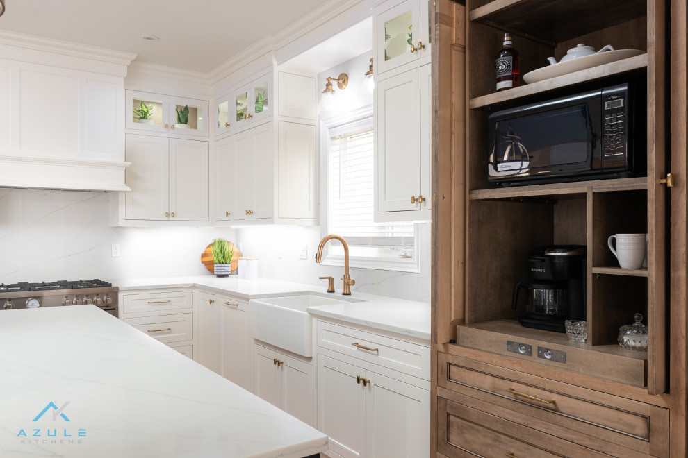 Design ideas for a large country l-shaped kitchen in Other with a farmhouse sink, beaded inset cabinets, white cabinets, quartz benchtops, white splashback, engineered quartz splashback, panelled appliances, medium hardwood floors, with island, multi-coloured floor and white benchtop.