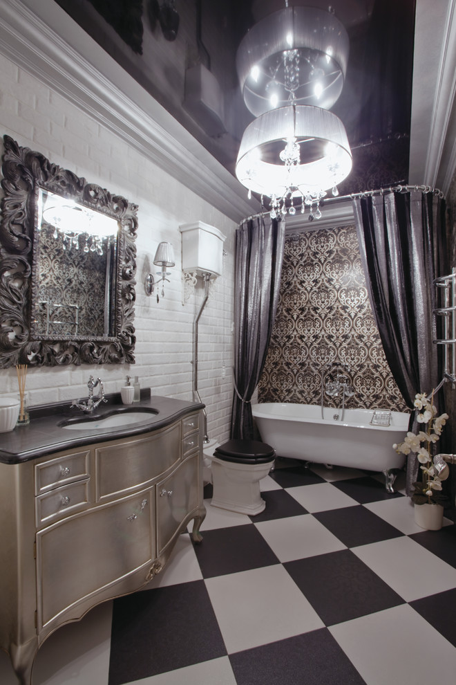 This is an example of a large traditional master bathroom in Moscow with a claw-foot tub, a two-piece toilet, white walls, an undermount sink, raised-panel cabinets, beige cabinets, white tile, black and white tile, ceramic floors and a shower curtain.