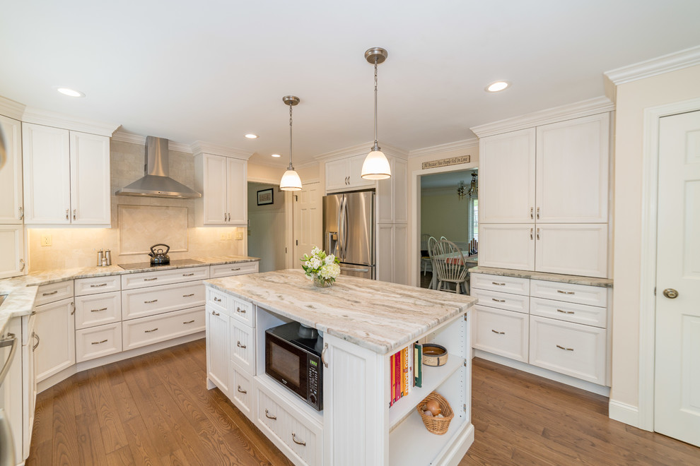 This is an example of a large traditional l-shaped separate kitchen in Bridgeport with an undermount sink, recessed-panel cabinets, white cabinets, granite benchtops, beige splashback, stainless steel appliances, dark hardwood floors, with island, brown floor and beige benchtop.