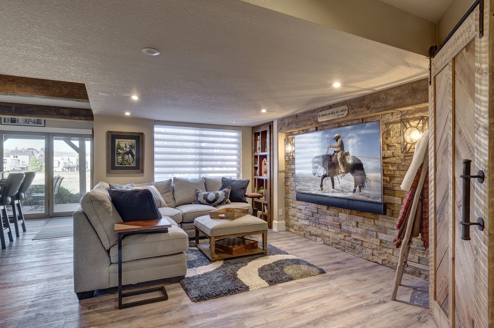 Design ideas for a mid-sized traditional look-out basement in Denver with grey walls, vinyl floors, no fireplace and brown floor.