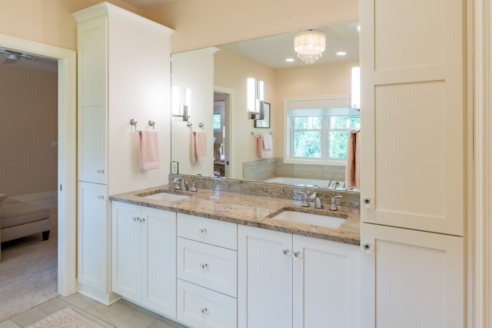 Transitional bathroom in Other with shaker cabinets, a drop-in tub, a curbless shower, ceramic tile, ceramic floors, granite benchtops, an open shower, multi-coloured benchtops, a shower seat and a double vanity.