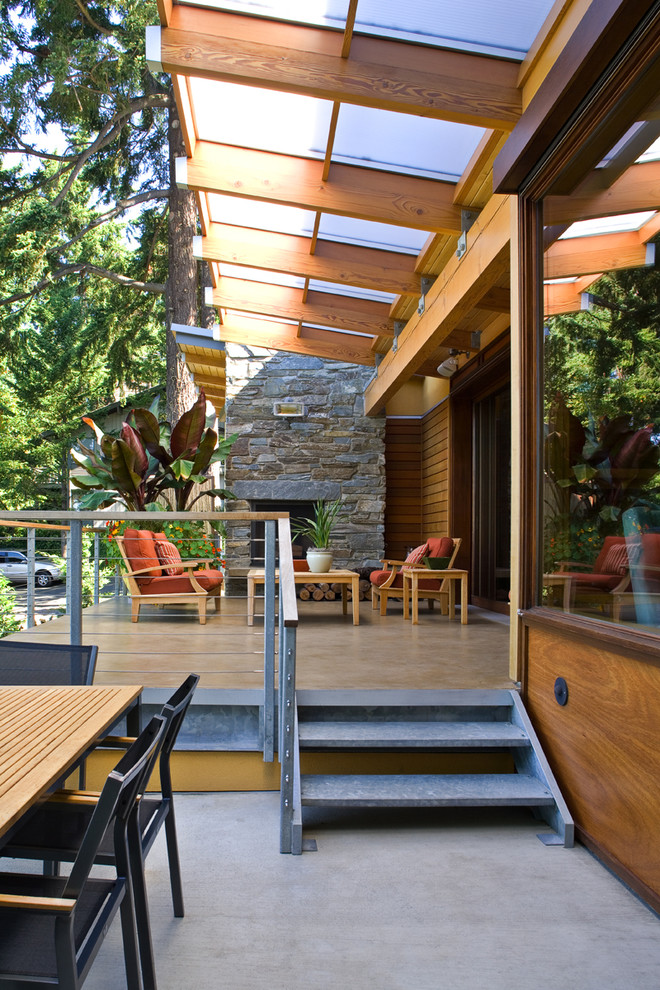Inspiration for a contemporary patio in Seattle with a fire feature.