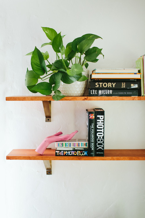 Living room - mid-sized eclectic formal and open concept medium tone wood floor living room idea in Los Angeles with white walls, no fireplace and no tv