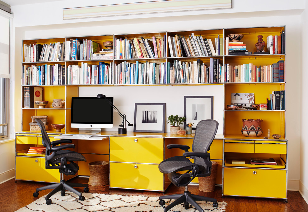 Contemporary home office in Milwaukee with white walls.