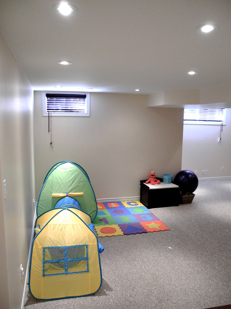 Mid-sized contemporary look-out basement in Ottawa with beige walls, carpet and no fireplace.