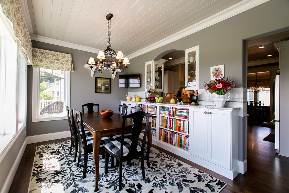 Traditional dining room in Other with grey walls.