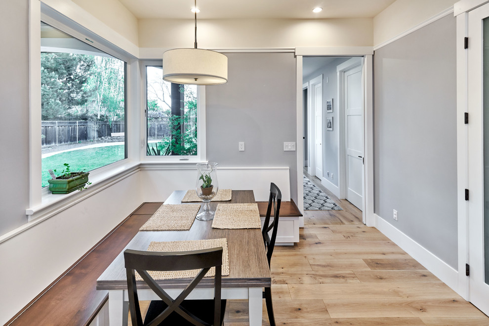 Mid-sized transitional open plan dining in San Francisco with grey walls and light hardwood floors.