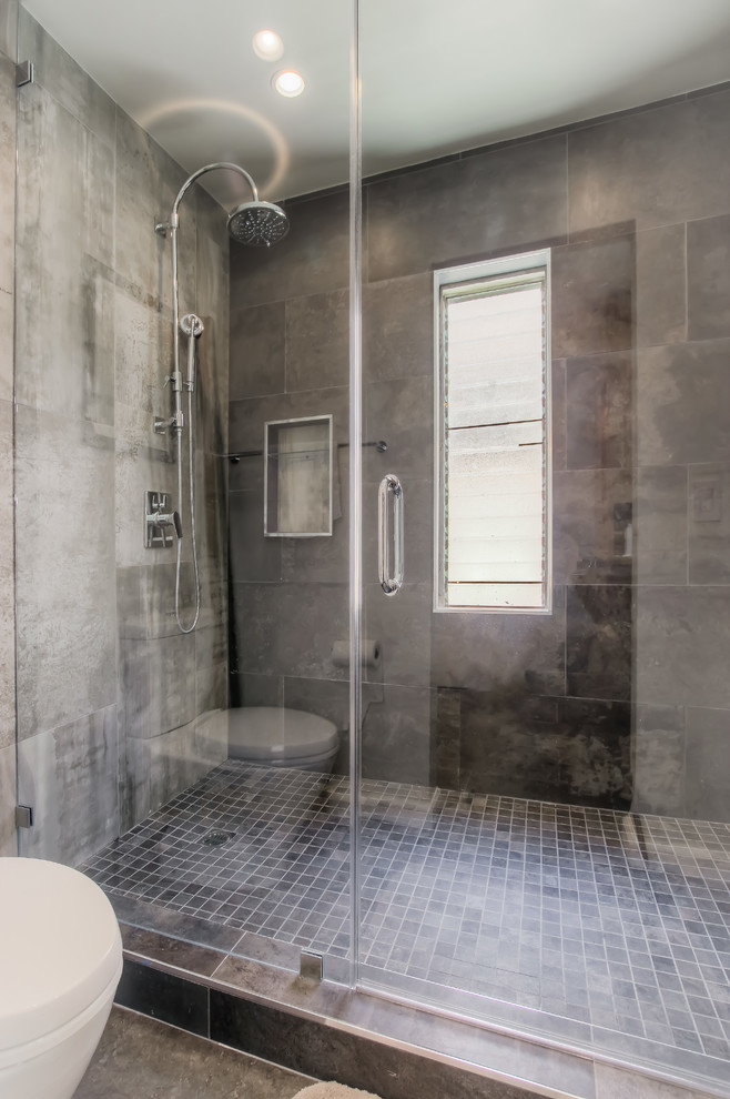 Inspiration for a large contemporary master bathroom in Los Angeles with open cabinets, medium wood cabinets, a japanese tub, an alcove shower, gray tile, ceramic tile, grey walls, concrete floors, a vessel sink, wood benchtops, grey floor and a hinged shower door.
