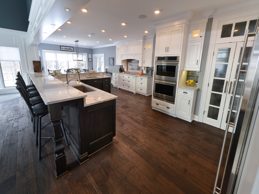 Example of a transitional dark wood floor kitchen design in Cleveland with a single-bowl sink and stainless steel appliances