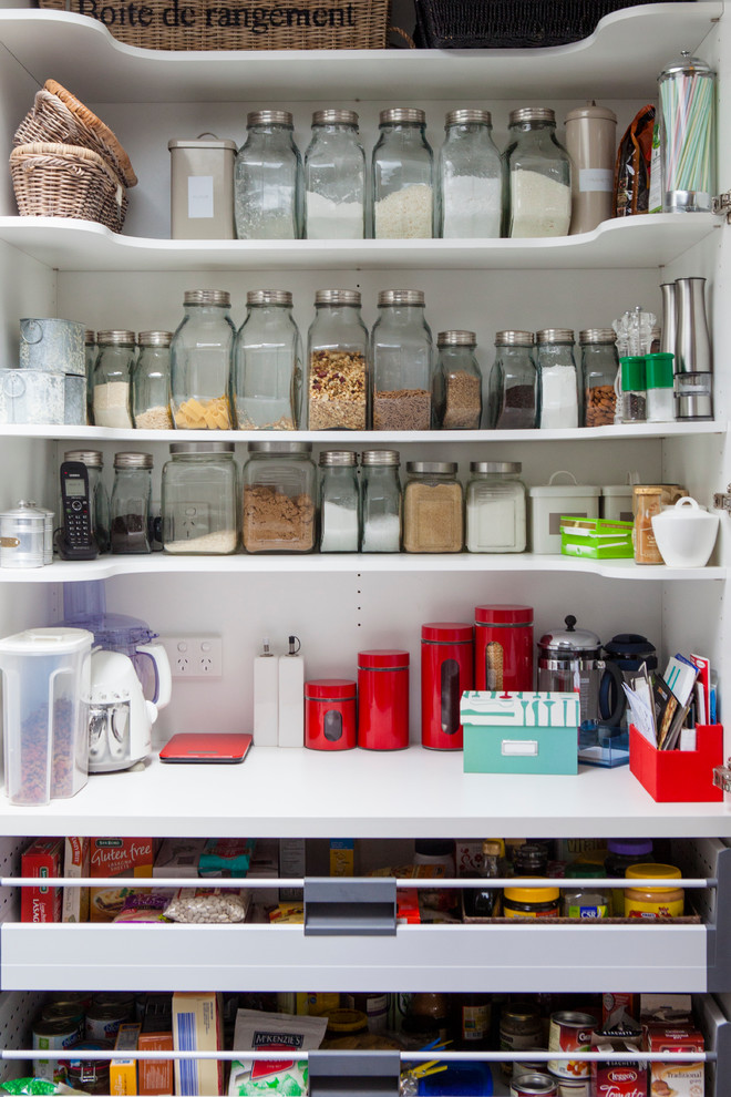 Photo of a large country kitchen pantry in Melbourne with dark hardwood floors.