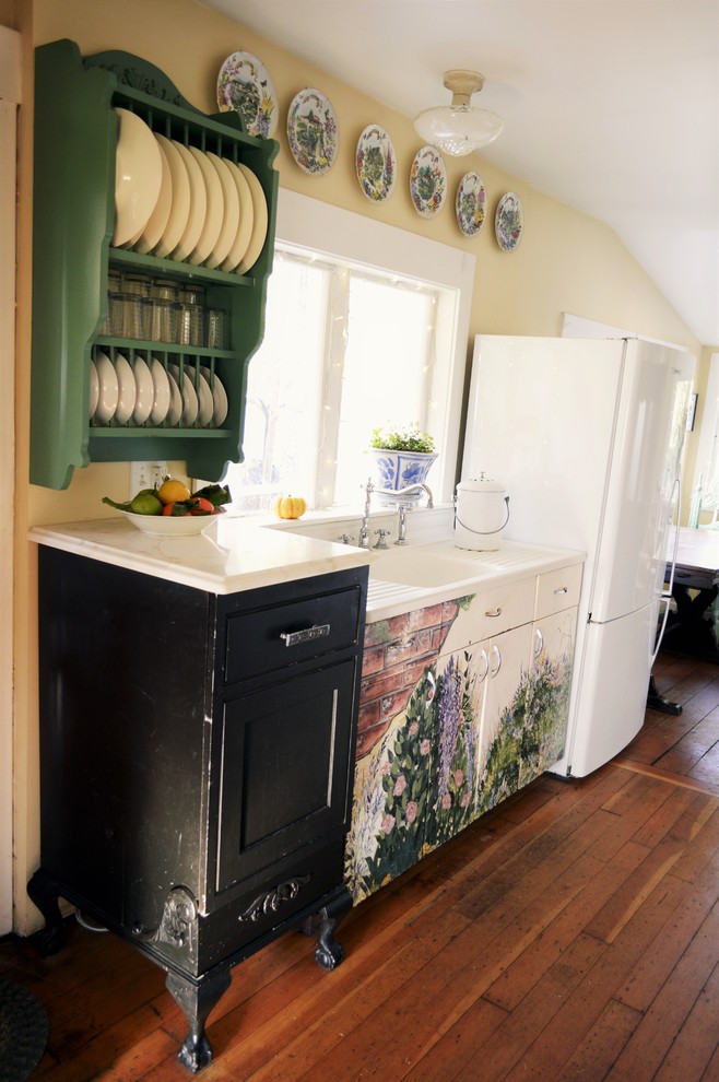 Photo of a mid-sized country eat-in kitchen in Seattle with an integrated sink, beaded inset cabinets, white cabinets, marble benchtops, panelled appliances and medium hardwood floors.