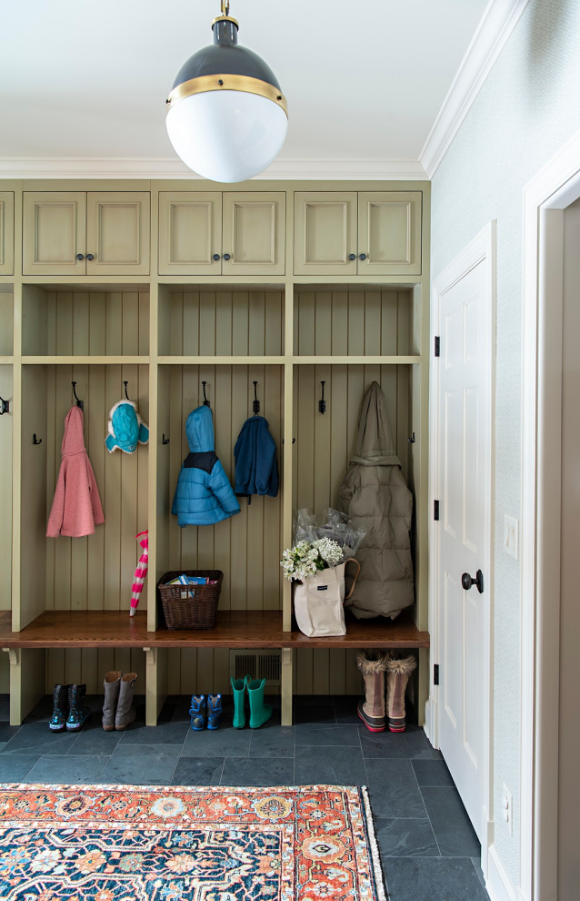 Inspiration for a traditional mudroom in Minneapolis with white walls and grey floor.