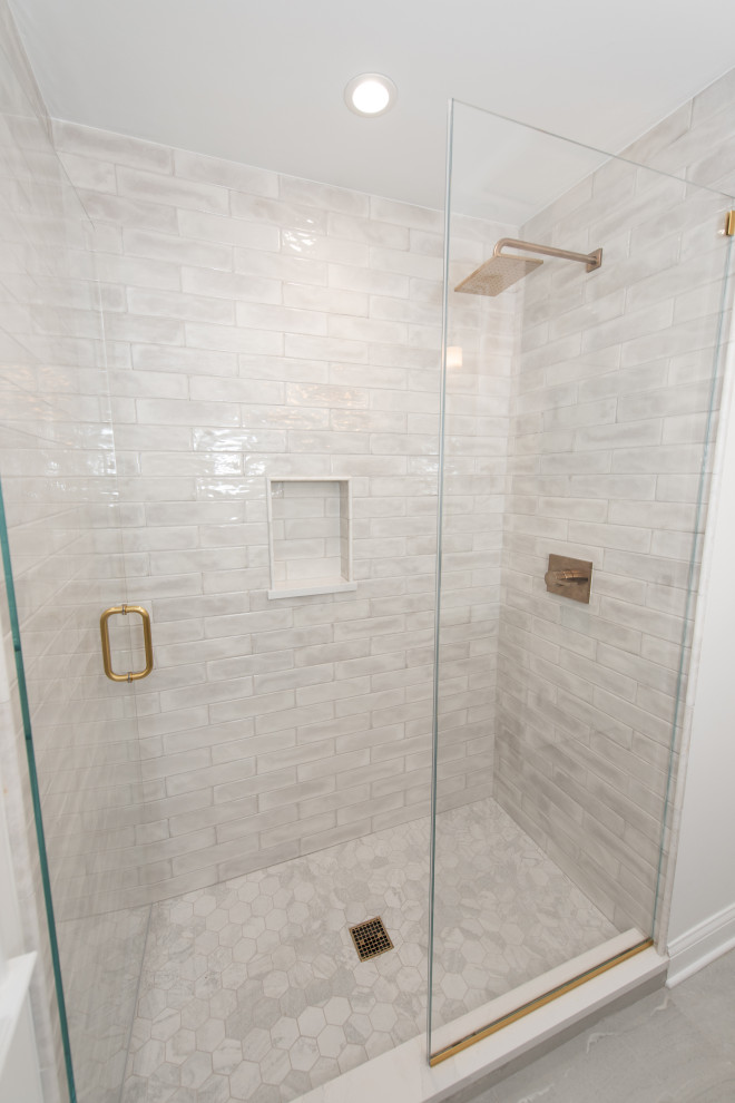 Design ideas for a small classic shower room bathroom in Chicago with shaker cabinets, medium wood cabinets, an alcove shower, white tiles, a submerged sink, engineered stone worktops, a hinged door, white worktops, a single sink and a freestanding vanity unit.