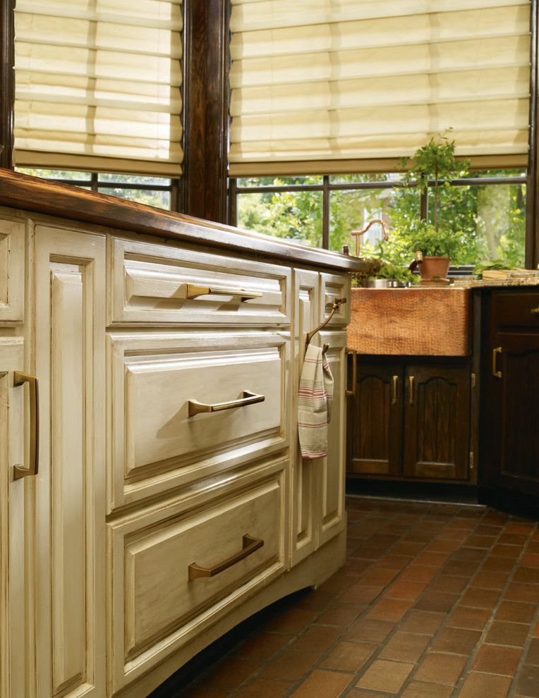 Example of a small mountain style kitchen design in Baltimore with beige walls, no fireplace, raised-panel cabinets and light wood cabinets