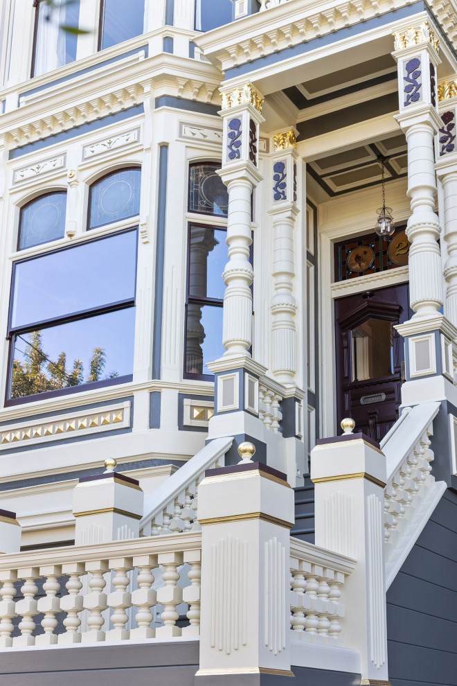 Large traditional two-storey beige house exterior in San Francisco with wood siding.