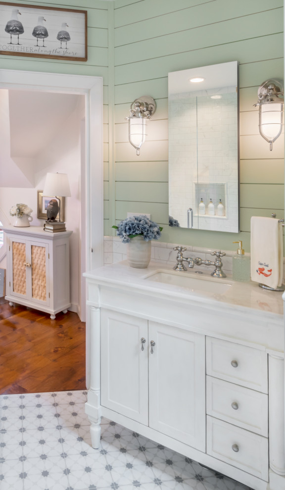 This is an example of a small beach style master wet room bathroom in Boston with beaded inset cabinets, white cabinets, a claw-foot tub, a one-piece toilet, white tile, ceramic tile, green walls, ceramic floors, a console sink, quartzite benchtops, grey floor, a hinged shower door, white benchtops, a single vanity, a built-in vanity and wood walls.