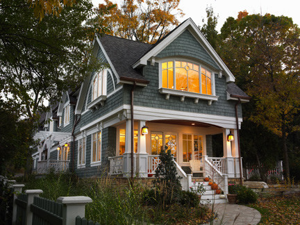 Inspiration for a mid-sized victorian two-storey blue exterior in Omaha with wood siding and a gable roof.