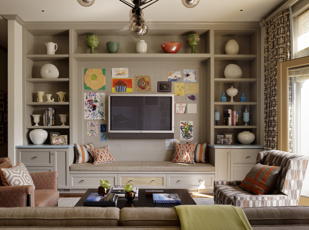Design ideas for a transitional family room in San Francisco with beige walls and a wall-mounted tv.