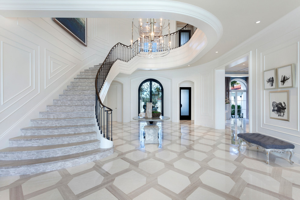 Expansive contemporary curved staircase in Miami with tile risers.