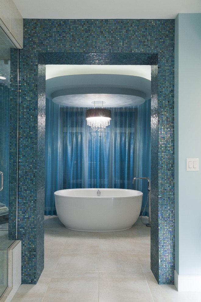 Design ideas for a contemporary bathroom in Other with a freestanding tub, blue tile and mosaic tile.