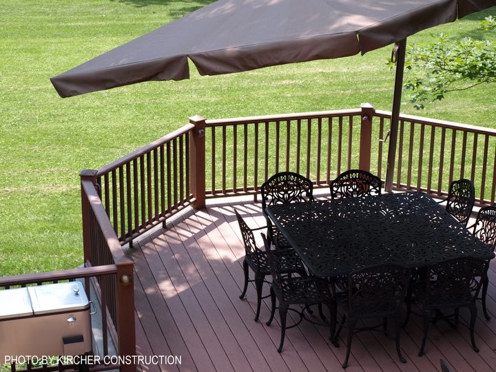 Large arts and crafts backyard deck photo in Cincinnati with a pergola