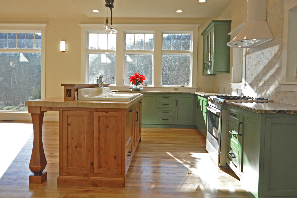 This is an example of a mid-sized country kitchen in Cincinnati.