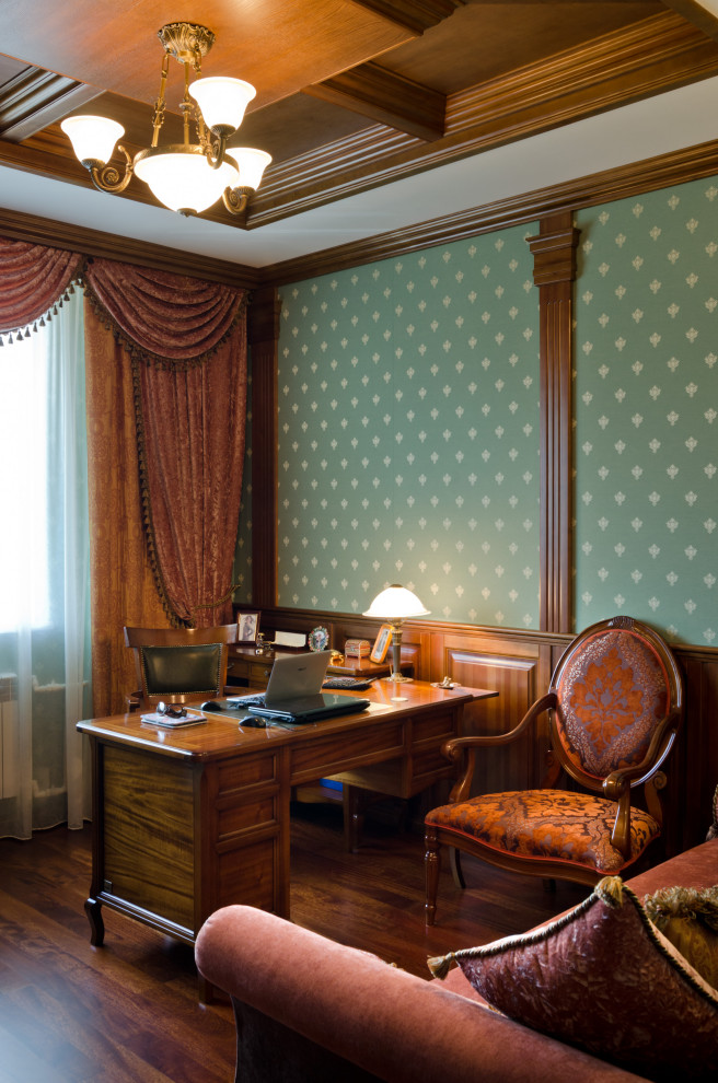 Mid-sized traditional study room in Novosibirsk with green walls, medium hardwood floors, a freestanding desk, brown floor, coffered, wood and decorative wall panelling.