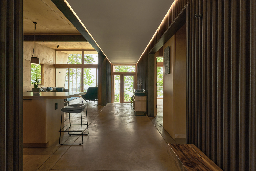 Example of a mountain style concrete floor hallway design in Seattle