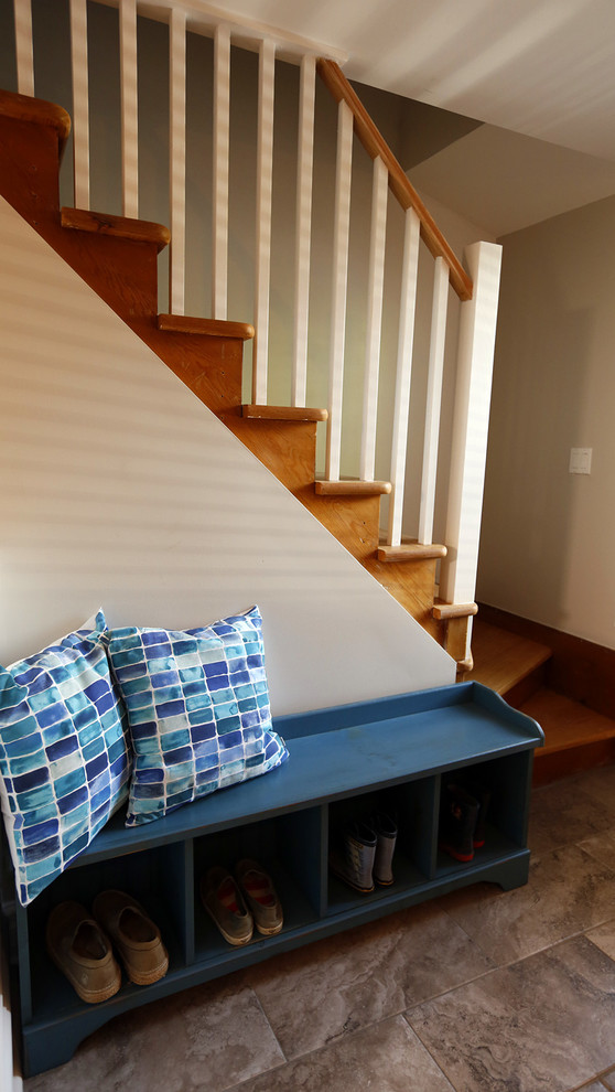 Mudroom - small transitional ceramic tile mudroom idea in Toronto with beige walls