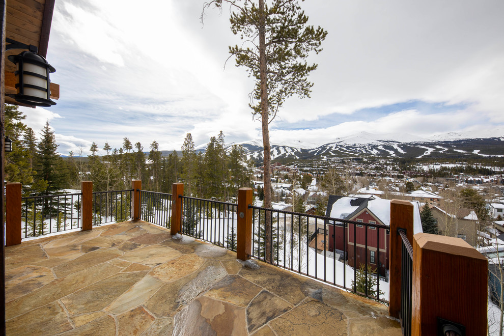 Example of a mountain style home design design in Denver