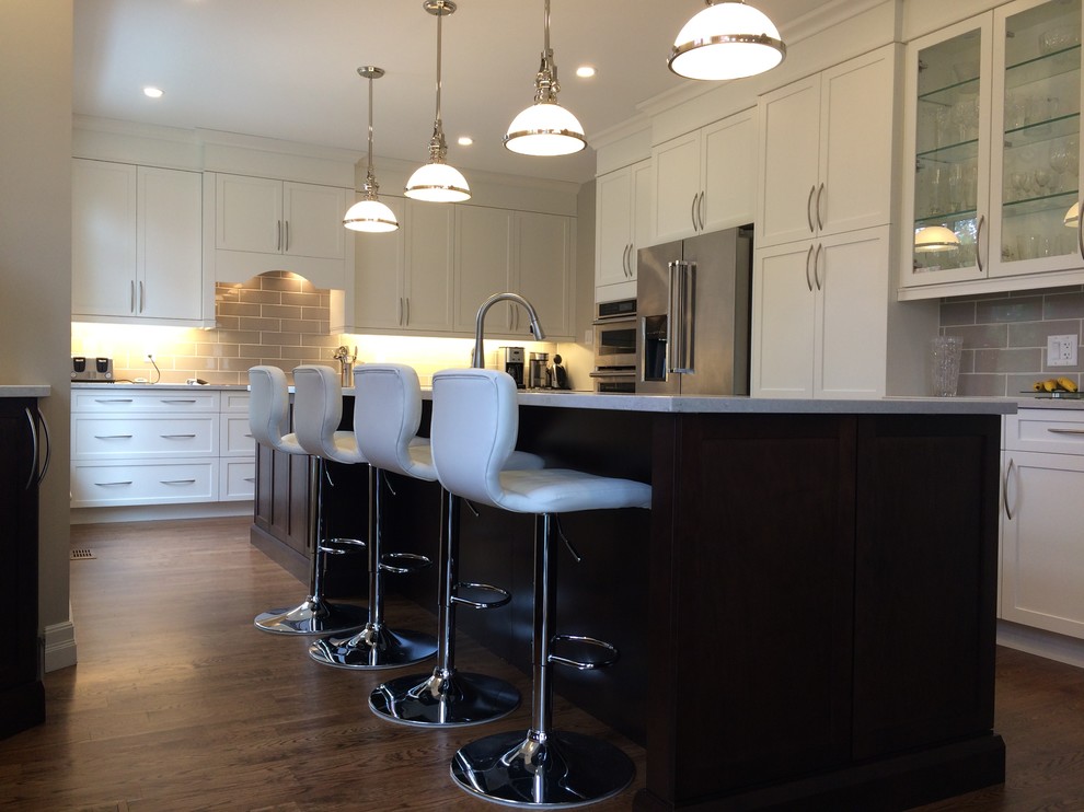 Example of a transitional kitchen design in Toronto