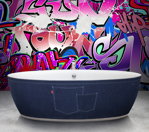 bath tub wrapped in denim in front of graffitied wall