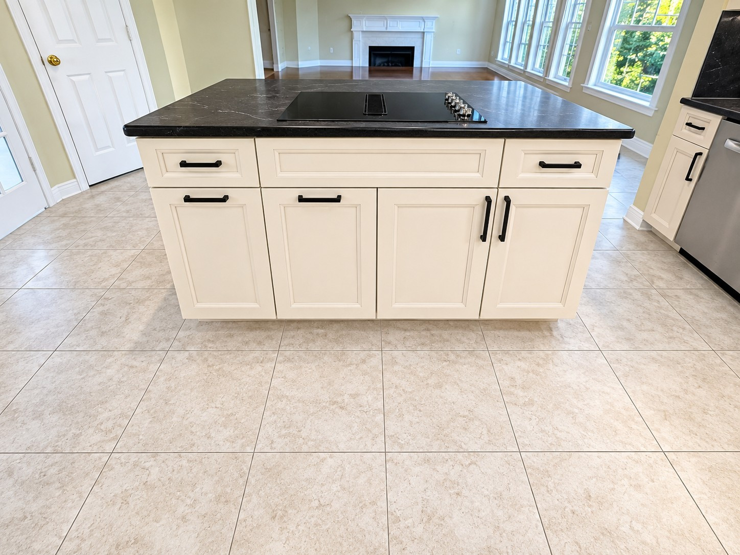 Custom Transitional Kitchen with Cream Shaker Cabinets & Black Countertops