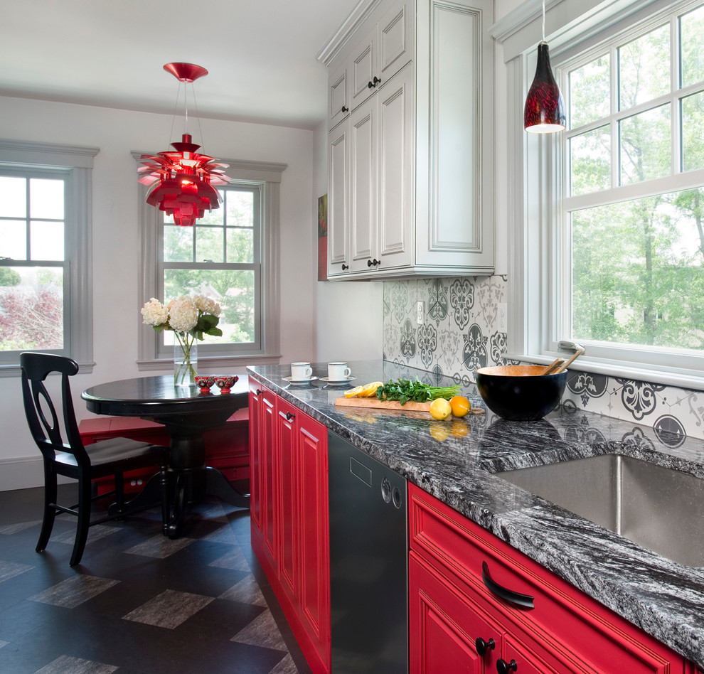 Mid-sized eclectic l-shaped eat-in kitchen in Boston with an undermount sink, raised-panel cabinets, red cabinets, granite benchtops, ceramic splashback, stainless steel appliances, linoleum floors, no island and grey splashback.