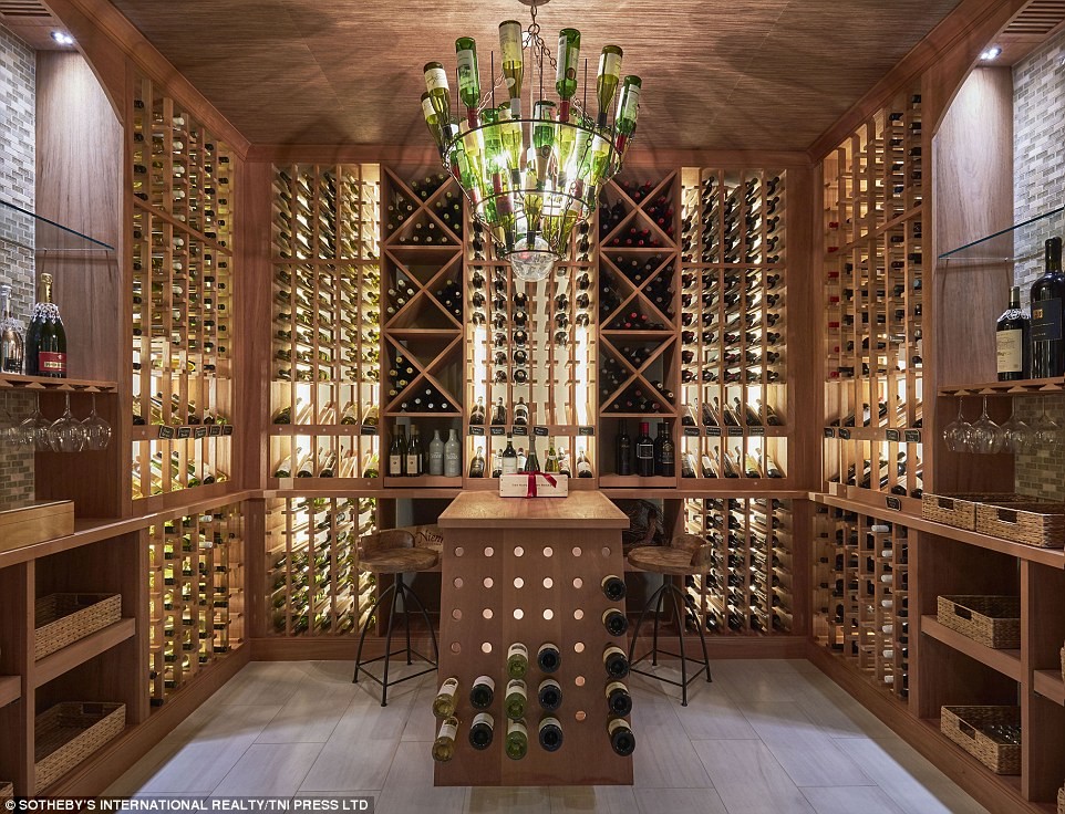 This is an example of a beach style wine cellar in Miami.