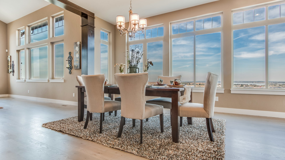 Kitchen/dining room combo - mid-sized transitional light wood floor kitchen/dining room combo idea in Denver with beige walls