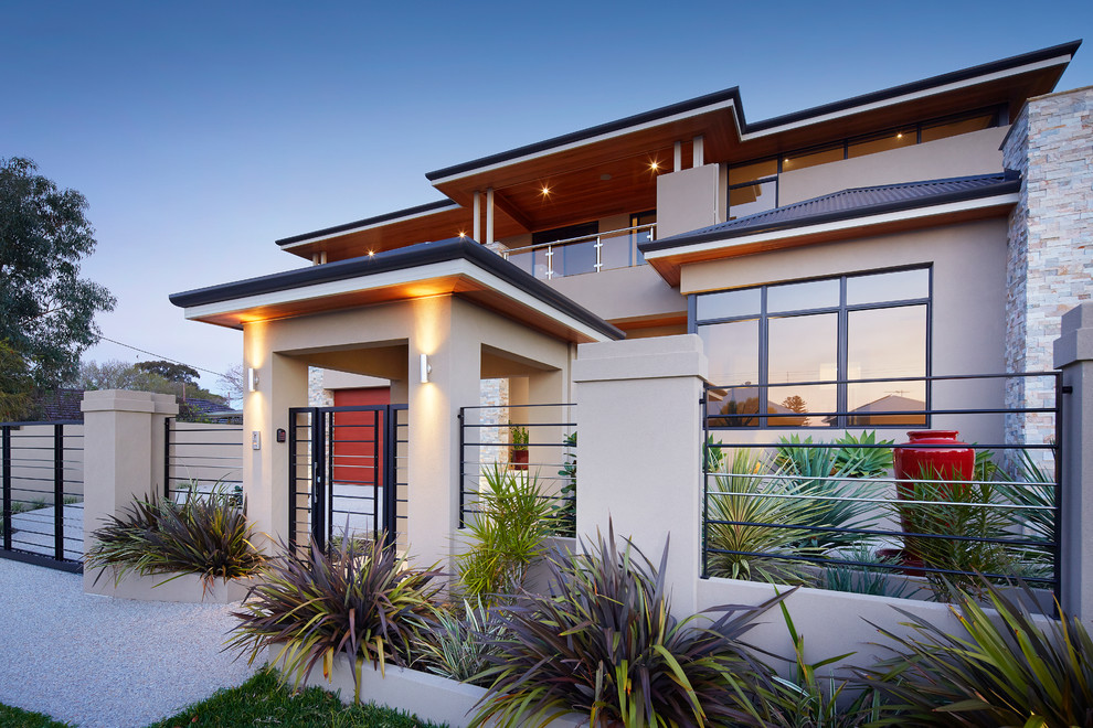 Design ideas for a large contemporary three-storey beige exterior in Perth.