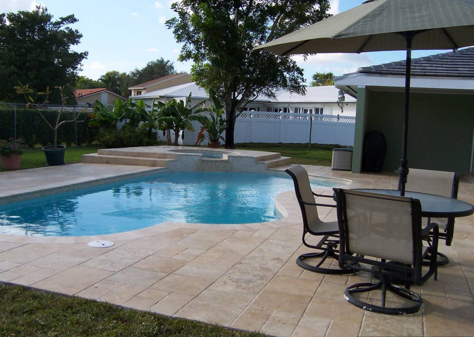Transitional backyard tile and custom-shaped natural hot tub photo in Miami