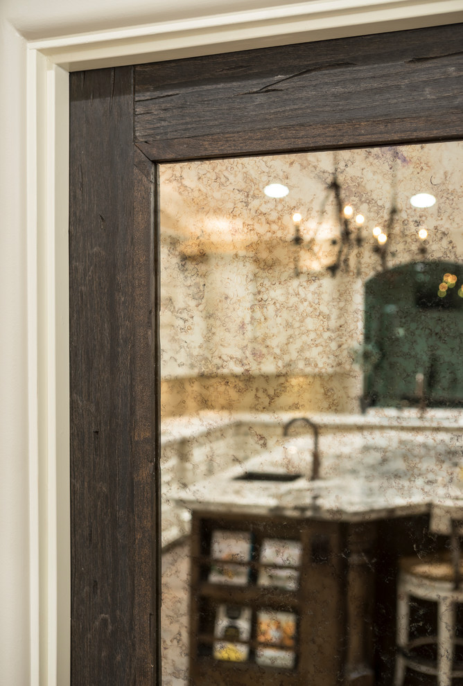 Example of a large transitional l-shaped medium tone wood floor and brown floor eat-in kitchen design in Phoenix with raised-panel cabinets, quartz countertops, beige backsplash, glass tile backsplash, stainless steel appliances, an island, an undermount sink and beige cabinets